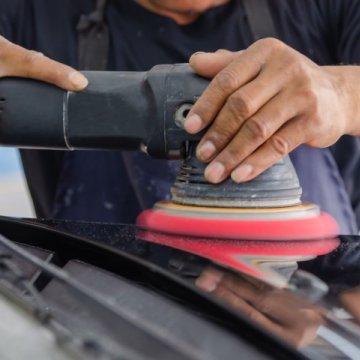 Rupes polisher on a white car